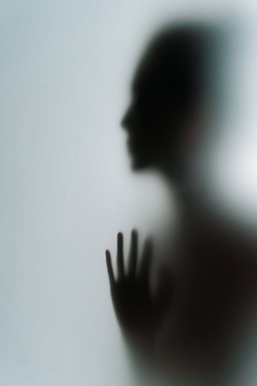 silhouette of person s hand and face profile